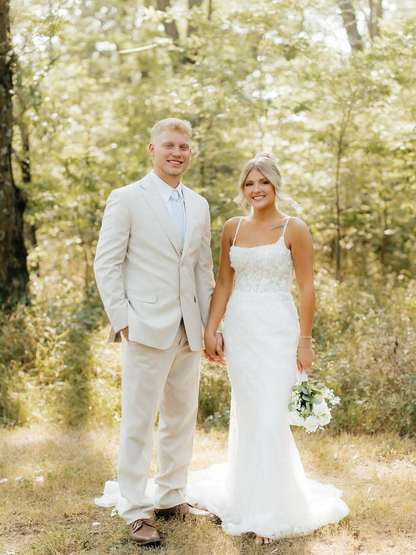 Bride and groom holding hands