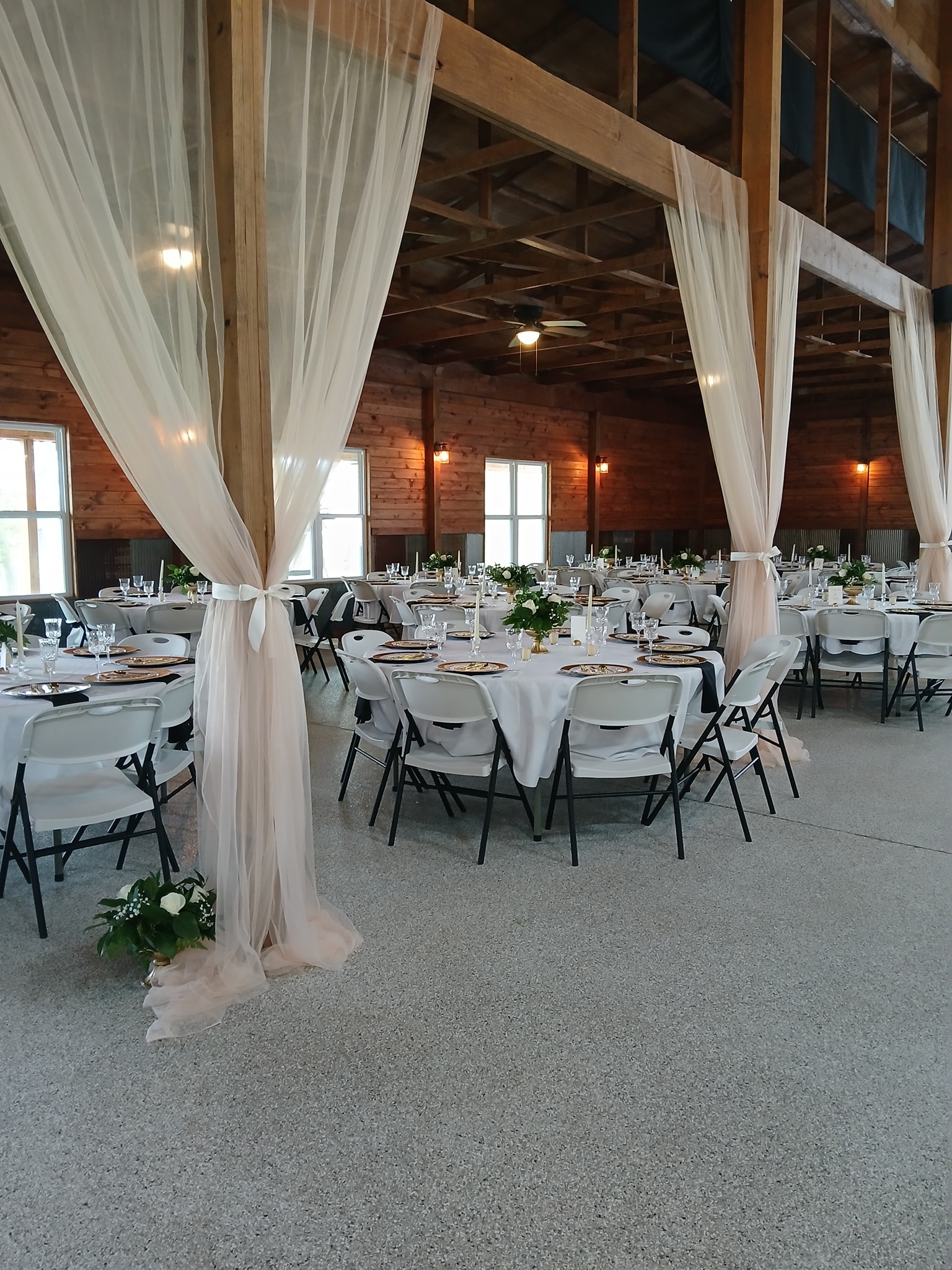 white tables with drapes